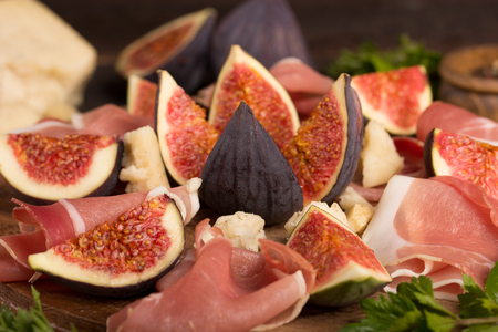 appetizer with ham , cheese and figの写真素材