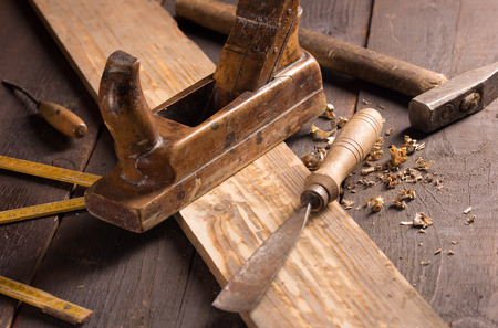 Old chisel and planer in a carpentry workshopの写真素材