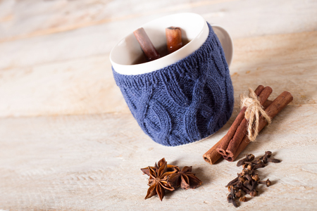 Mulled wine with spices on wooden tableの写真素材