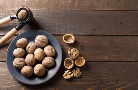 top view of walnuts with nutcrackerの写真素材