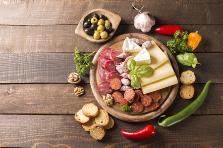 appetizer with sausages,cheese,olive and nutsの写真素材