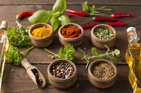 Powder spices on  wooden table backgroundの写真素材