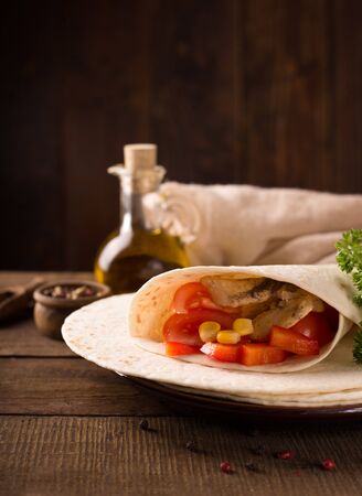 Stack of homemade tortilla on wooden table backgroundの写真素材