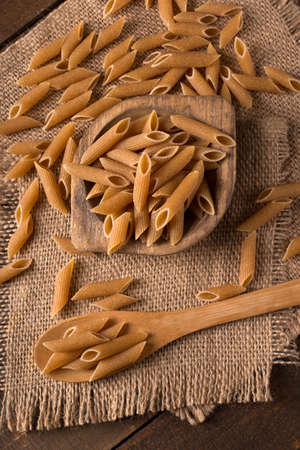 Bowl of penne noodles in rustic styleの写真素材
