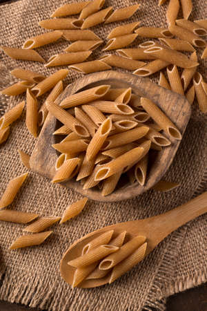 Bowl of penne noodles in rustic styleの写真素材