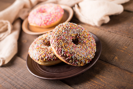 donuts on rustic kitchen tableの写真素材