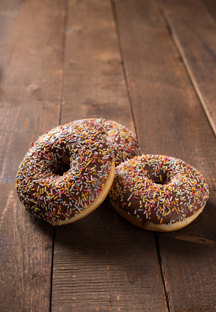 donuts on rustic kitchen tableの写真素材