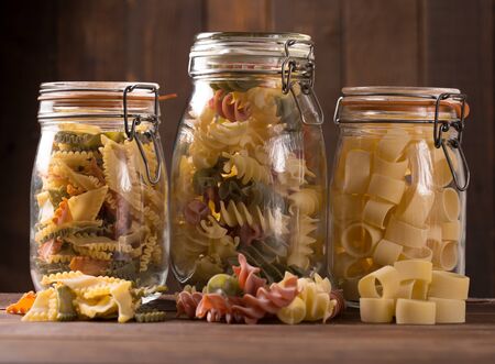 various colored pasta in rustic style の写真素材