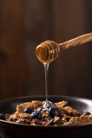 Muesli with blueberry and honey - healthy breakfast の写真素材