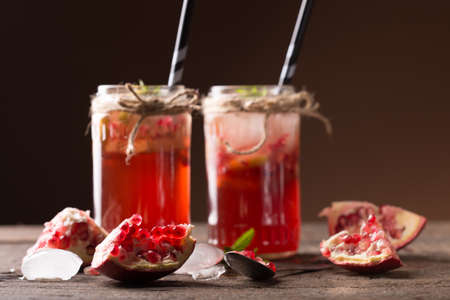 pomegranate juice on wooden tableの写真素材