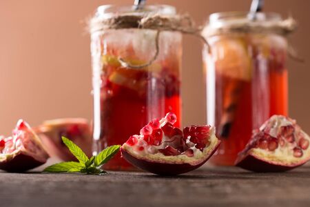 pomegranate juice on wooden tableの写真素材