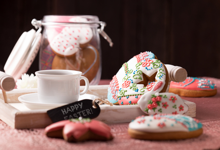 beautiful easter cookies with a cup of coffeeの写真素材