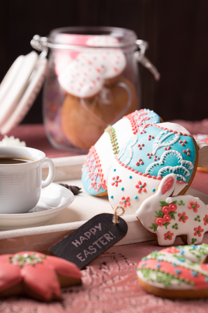 beautiful easter cookies with a cup of coffeeの写真素材