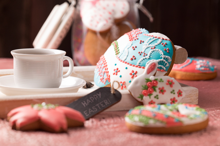 beautiful easter cookies with a cup of coffeeの写真素材