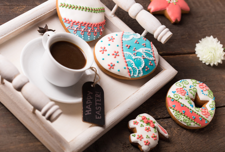 beautiful easter cookies with a cup of coffeeの写真素材