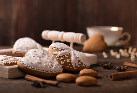Beautiful gingerbread heart cookies on a wooden brown backgroundの写真素材