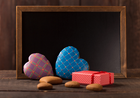 beautiful decorated gingerbread cookies in front of a blackboard の写真素材