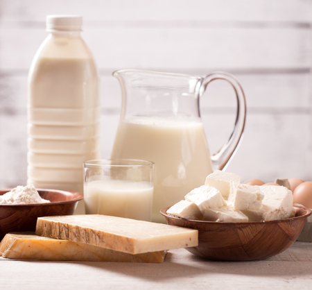 Milk and dairy products on wooden tableの写真素材