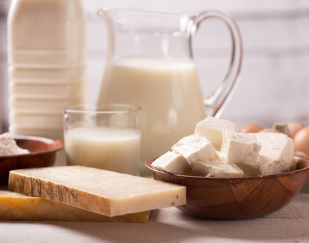 Milk and dairy products on wooden tableの写真素材