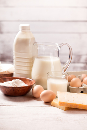 Milk and dairy products on wooden tableの写真素材