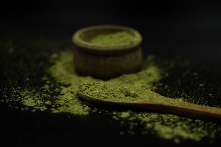 green matcha tea over black background の写真素材
