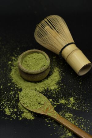 green matcha tea over black background