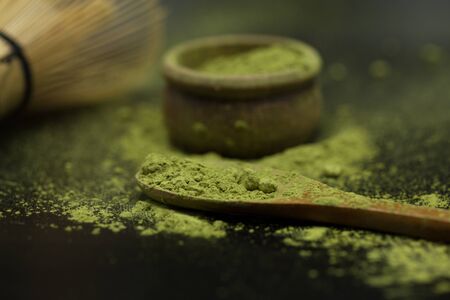 green matcha tea over black backgroundの写真素材
