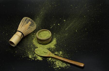 green matcha tea over black backgroundの写真素材