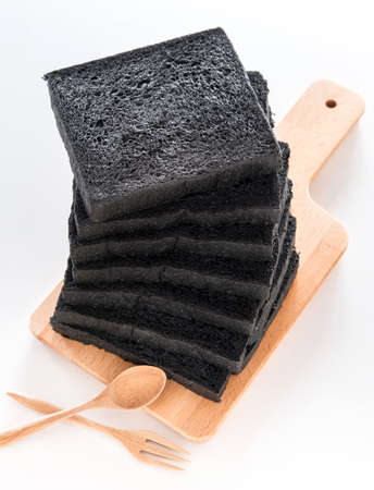 Charcoal Bread on wooden cutting board