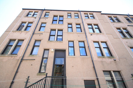 vertical view of the back of a block of residential flats in glasgow in scotland.の写真素材