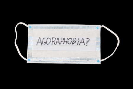 agorophobia drawn on a face mask with black background.