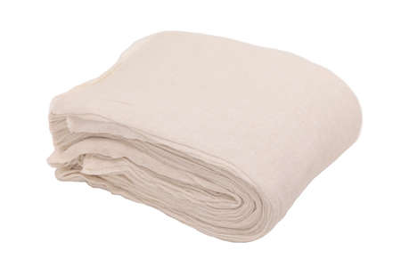 large bundle of off white cleaning cloths folded over onto themselves.の写真素材