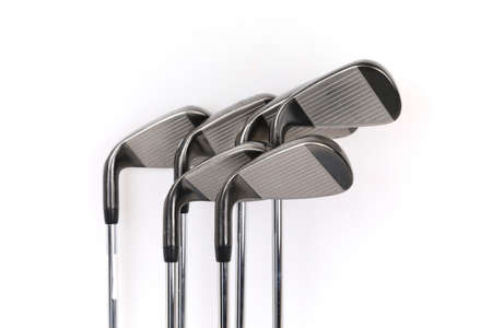 pictures of the head and neck of various sized silver golf irons showing the face of the club against a white background.の写真素材