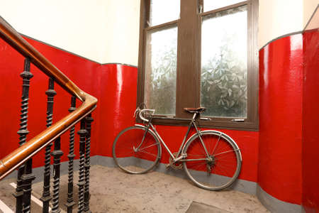 bike against the wall of a tenement closeの写真素材
