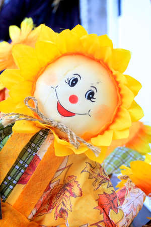 portrait of a smiling happy yellow sunflower character in a shop.