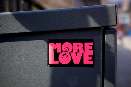 more love sticker seen on the side of a black refuse binの写真素材