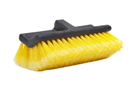 interchangeable black coloured brush head with bright yellow bristles for cleaning the floorの写真素材