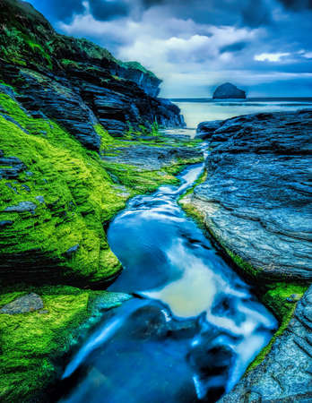Trebarwith strand in North Cornwall a beautiful coastal scenery landscape with the rugged rocks
