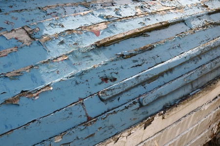 close up of the hull of an old boat in a distressed and worn  conditionの写真素材