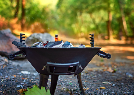 Barbecue grill with fire on nature, outdoor, close upの写真素材