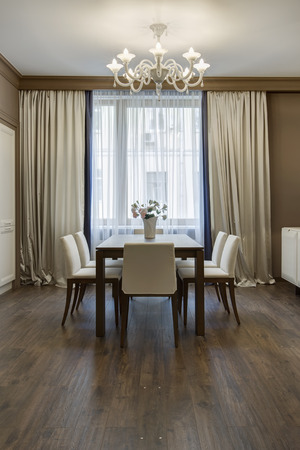 beautiful apartment, interior room with table and five chairsのeditorial素材