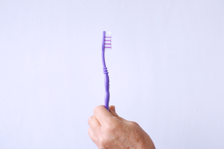 toothbrush in the hands of a woman