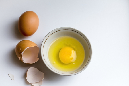 broken egg in a cup