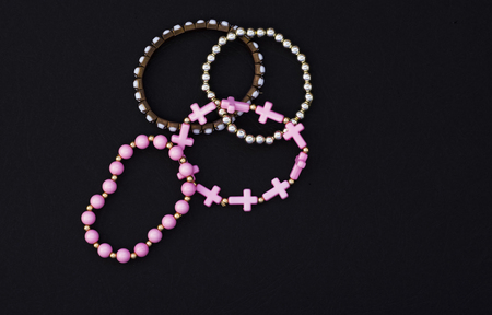 set of women's beautiful bracelets on black background with copy space.の写真素材