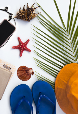 flat layout, tropical background, the concept of travel and leisure on the beach with a smartphoneの写真素材