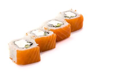 Delicious fresh sushi rolls with salmon and Philadelphia cheese on white background.