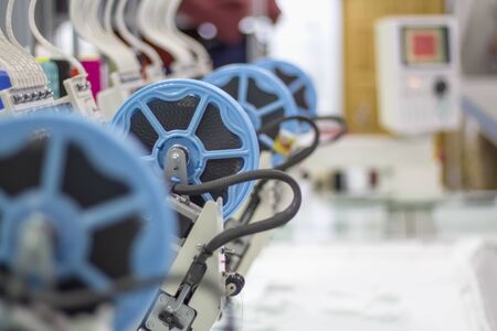 device for sewing sequins on a production embroidery machine.の写真素材