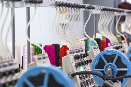 embroidery threads on a production embroidery machine.の写真素材