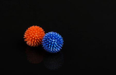 model of two viruses in blue and red on a black backgroundの写真素材