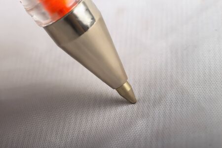 Silver ballpoint pen isolated on white backgroundの写真素材